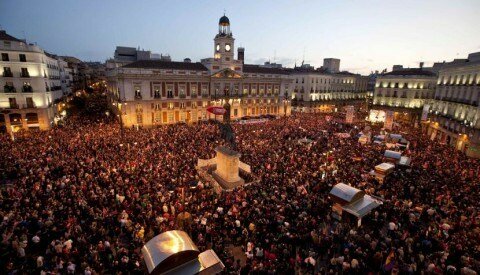 Protesters crowd Madrid's Puerta del Sol square during a rally at the end of a nationwide general strike